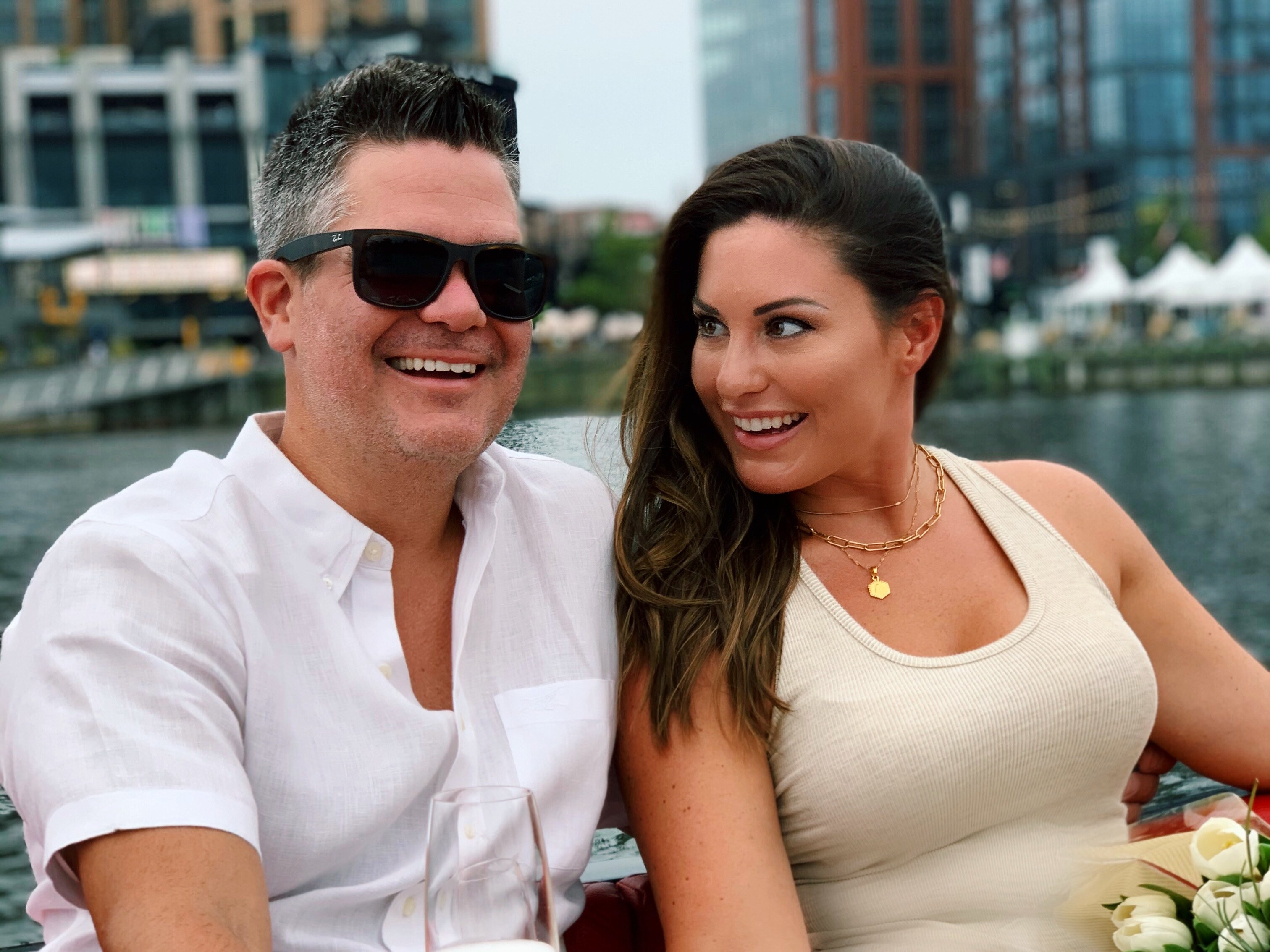 A couple toasting champagne on a Yachtsy sunset cruise at DC's Navy Yard