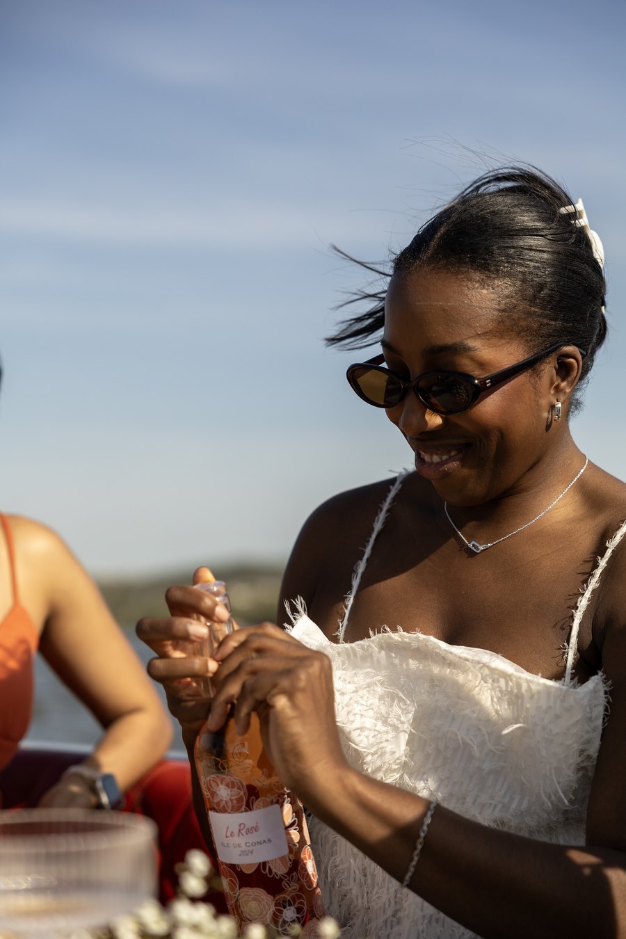 A guest enjoying snacks at the table on a private Yachtsy sunset cruise