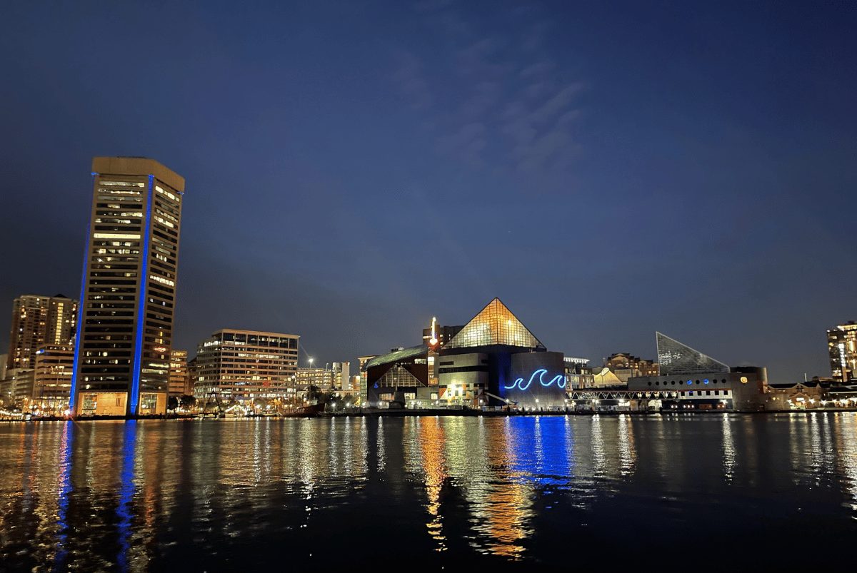 Baltimore's Inner Harbor and National Aquarium lit up at night